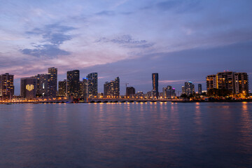 Fototapeta na wymiar Night panoramic photo of Miami landscape. Miami Downtown behind MacArthur Causeway shot from Venetian Causeway.
