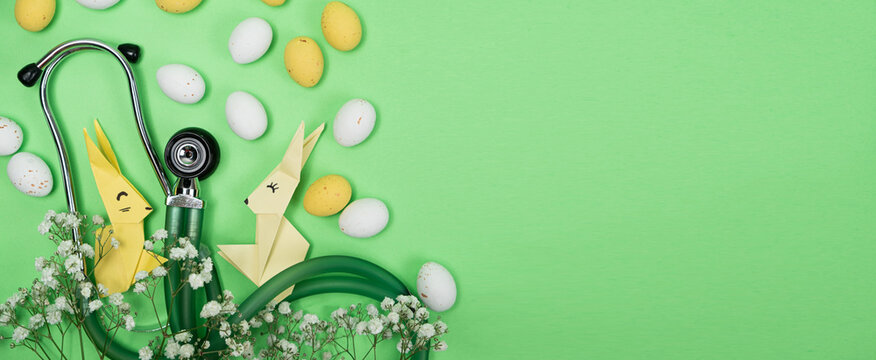 Happy and healthy Easter - medical banner with stethoscope, Easter bunny and eggs, place for text