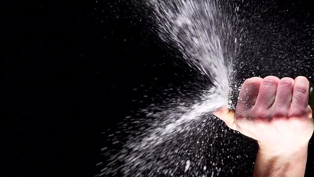 Super slow motion shot of champagne explosion, opening champagne bottle closeup. Filmed on high speed cinema camera, 4k1000fps