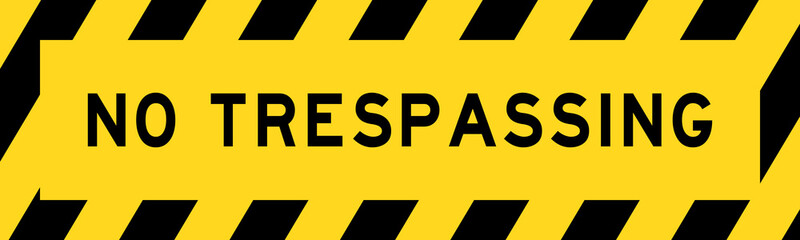 Yellow and black color with line striped label banner with word no trespassing - obrazy, fototapety, plakaty