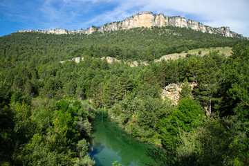 Fototapeta na wymiar Mountainous landscape with a river running through the valley