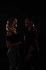 woman and man look at each other with love