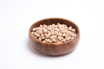 Uncooked chickpeas in wooden bowl. Healthy food concept