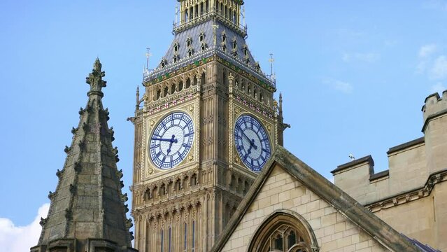 Big Ben tower clock, Palace of Westminster, Houses of Parliament in London. Famous English tourism destination, iconic landmark, travel in England. 4k slow motion.