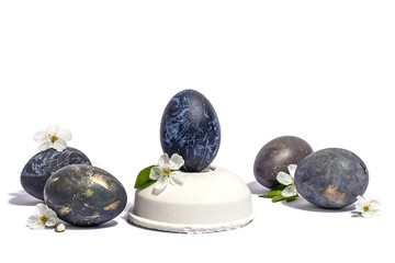 Easter egg on a beton stand isolated on white background. Traditional symbol, blooming cherry