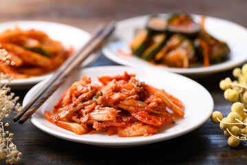 Kimchi cabbage, radish and cucumber on wooden background, Korean food homemade side dish