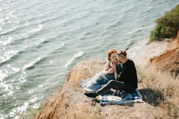 Fototapeta premium pregnant girl and boyfriend on high hills