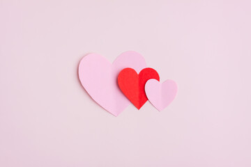 Red and Pink Paper Hearts on pink background, Heart shape papercut , Happy Valentine's day