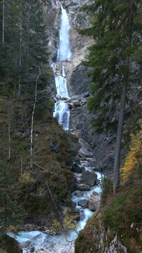 Autumn View of Waterfall Martuljek in Julian Alps Slovenia Vertical 4k Video