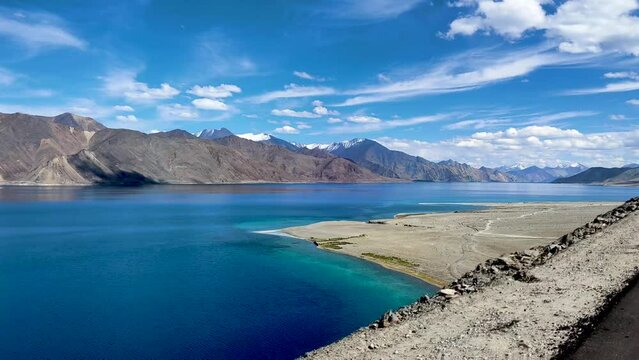 Pangong Lake car drive, fast moving car with blue lake view
