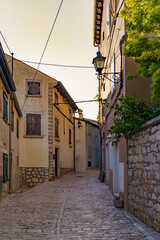 Fototapeta na wymiar An old atmospheric city with narrow and cramped quiet streets and stairs