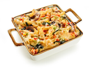 Appetizing baked penne in casserole on table