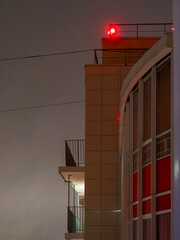 Red light signal on the top of highrise residential building