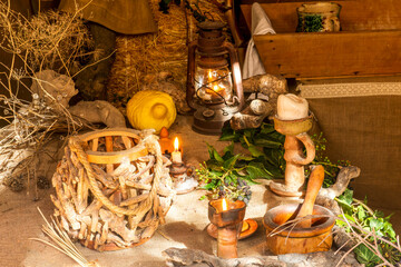 Fototapeta na wymiar rustic stil life in old traditional vintage style with basket of fruit , hay and vintage dishes and vases