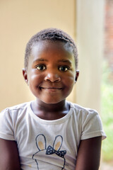 village african girl sitting in the backyard