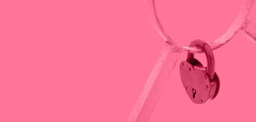 Fragment of the lattice of a bridge on which wedding lock hang. Magenta colored. Valentines day and wedding concept