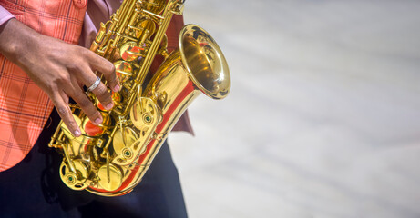african man playing the saxophone