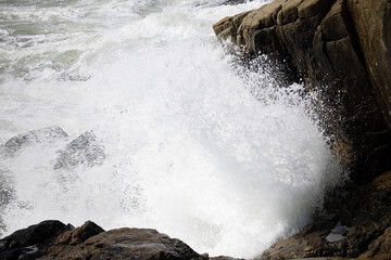 Ocean waves splashing on a rocky shore