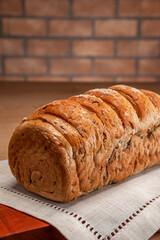 Wholemeal bread on bricks wall background.