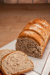 Wholemeal bread on wooden table.