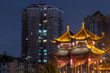 Plakat Hejiang pagoda illuminated at night in Chengdu, Sichuan province, China