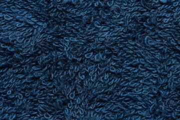 Texture of a blue terry cotton towel, canvas.