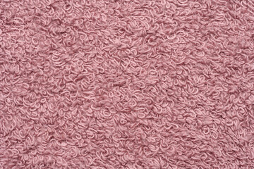 Texture of pink terry cotton towel, canvas. Macro