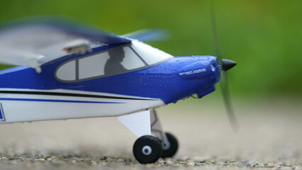 Airplane toy starting electric engine and taking off. Propeller aeoplane departure © Marco