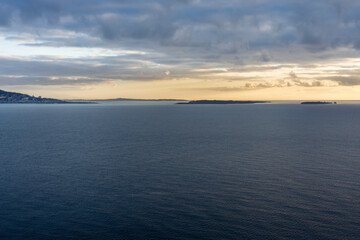 Fototapeta premium Sunrise over bay of Cannes with Cap d'Antibes and Iles de Lerins, France
