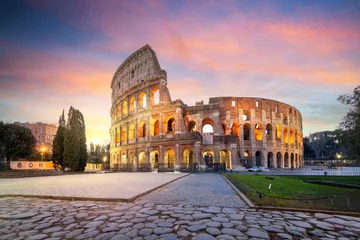 Papier Peint photo Rose clair The Colosseum in Rome, Italy at dawn.