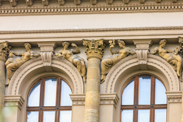 Fototapeta premium Ancient bas-reliefs in the architecture of the city. Historical and cultural heritage. Background with selective focus