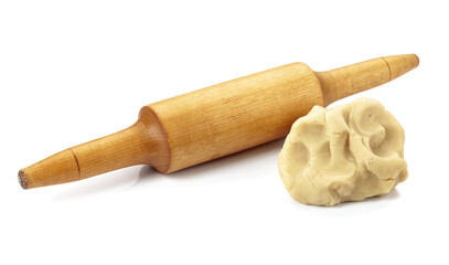 Dough and rolling pin on a white background.