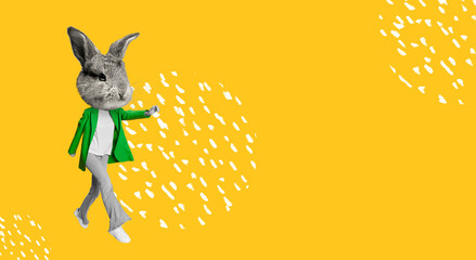 Cute bunny, rabbit head on female body in green suit over bright yellow background. Happy Easter. Concept of holidays, spring, celebration, family gathering. Copy space for ad, text. Design for card