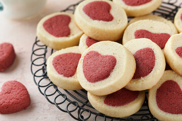 Valentines day cookies. Shortbread cookies inside a sweet red heart on pink plate on pink background. Mothers day. Womans day. Sweet holidays baking. Top view.