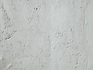 Fototapeta premium Grunge texture of an old concrete surface. Weathered grey plastered wall background with cracks and scratches.