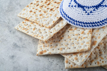 Passover celebration concept. Matzah, red kosher and walnut. Traditional ritual Jewish bread...