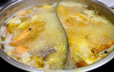 Boiled soup in hot pot, Close up shot