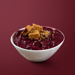 Frozen Acai Berry with Pacoca. Isolated on Purple Background