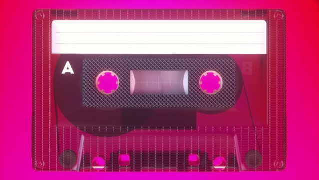 Rotating tape on an old vintage cassette. Retro music concept. Radio tape recorder, audio cassette