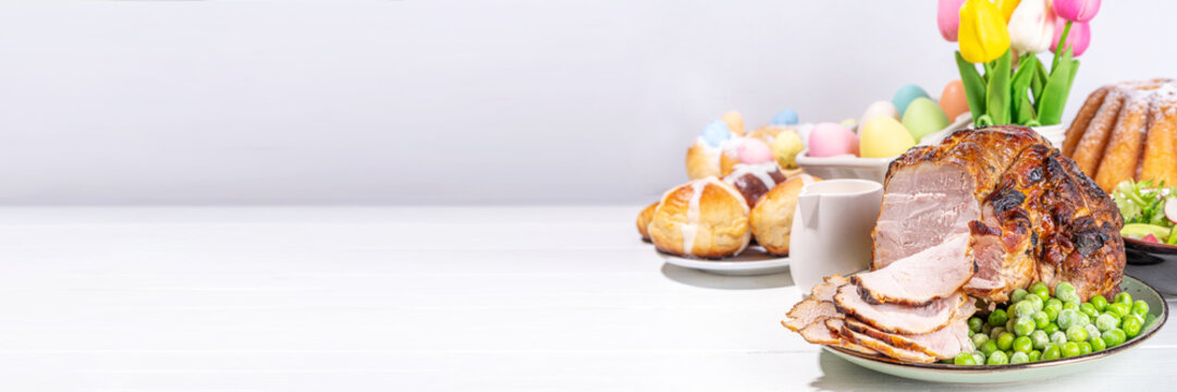 Traditional glazed baked pork. Homemade roasted ham, on festive served Easter lunch or brunch table