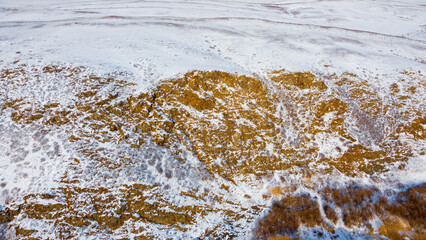 Snow-covered hilly fields