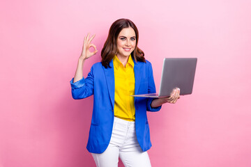 Photo of young business lady wear yellow shirt blue jacket hold netbook show okey sign new eshop...
