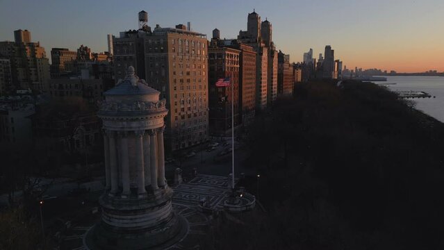 alt sunset rising over Soldiers and Sailors Monument in Riverside park NYC