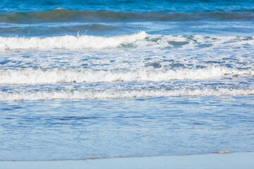 Fototapeta na wymiar dark blue ocean waves on the beach