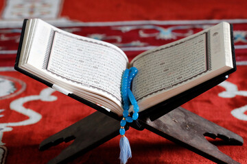 Open Quran and Muslim prayer beads on wood stand, symbol of Islam, An Giang, Vietnam, Indochina, Southeast Asia, Asia