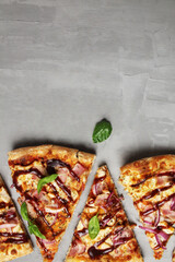 pizza background on a gray background with dark sweet and sour sauce and basil. with space for copyspace text. Fast food