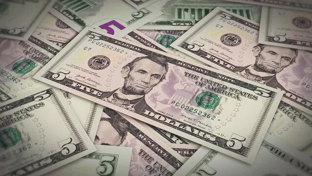 Pile of american dollars cash money, inflation concept. Closeup new american five dollar bills 4k resolution