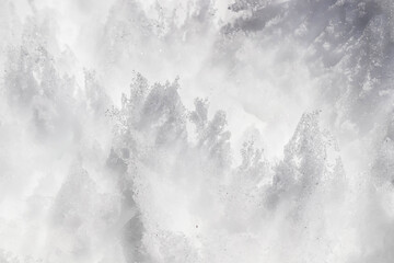 a pile of melting snow in a park in nature as a background