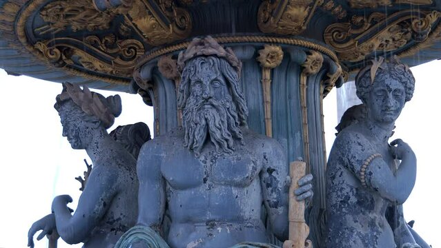 Statues of the Fountain of the Seas on the Place de la Concorde square in Paris, France