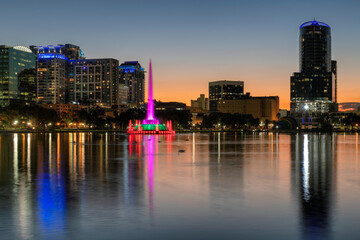 Orlando city at night in Lake Eola Park with fountain and cityscape, Florida, USA